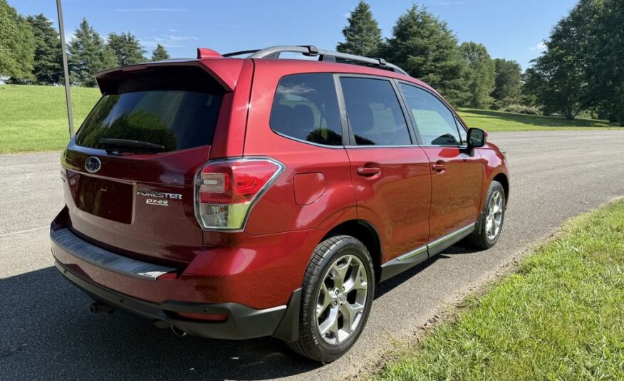 2017 Subaru Forester 2.5i Touring   <a href='http://www.carfax.com/VehicleHistory/p/Report.cfx?partner=DVW_1&vin=JF2SJAWC2HH555902'><img src='http://www.carfaxonline.com/assets/subscriber/carfax_free_button.gif' width='120' height='49' border='0'></a>