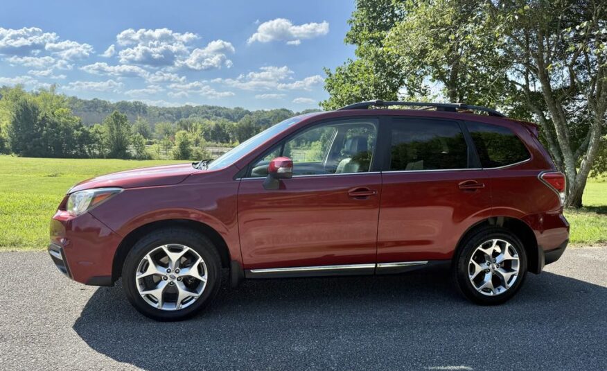 2017 Subaru Forester 2.5i Touring   <a href='http://www.carfax.com/VehicleHistory/p/Report.cfx?partner=DVW_1&vin=JF2SJAWC2HH555902'><img src='http://www.carfaxonline.com/assets/subscriber/carfax_free_button.gif' width='120' height='49' border='0'></a>