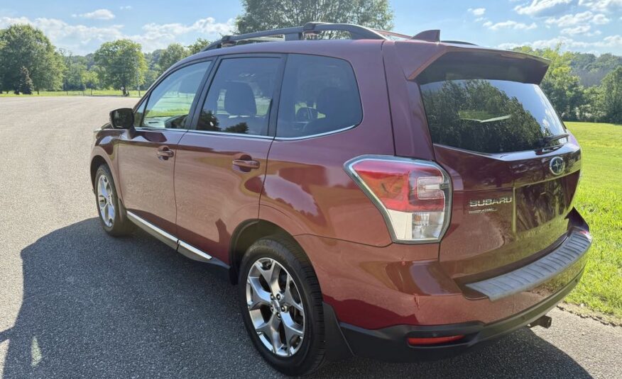 2017 Subaru Forester 2.5i Touring   <a href='http://www.carfax.com/VehicleHistory/p/Report.cfx?partner=DVW_1&vin=JF2SJAWC2HH555902'><img src='http://www.carfaxonline.com/assets/subscriber/carfax_free_button.gif' width='120' height='49' border='0'></a>