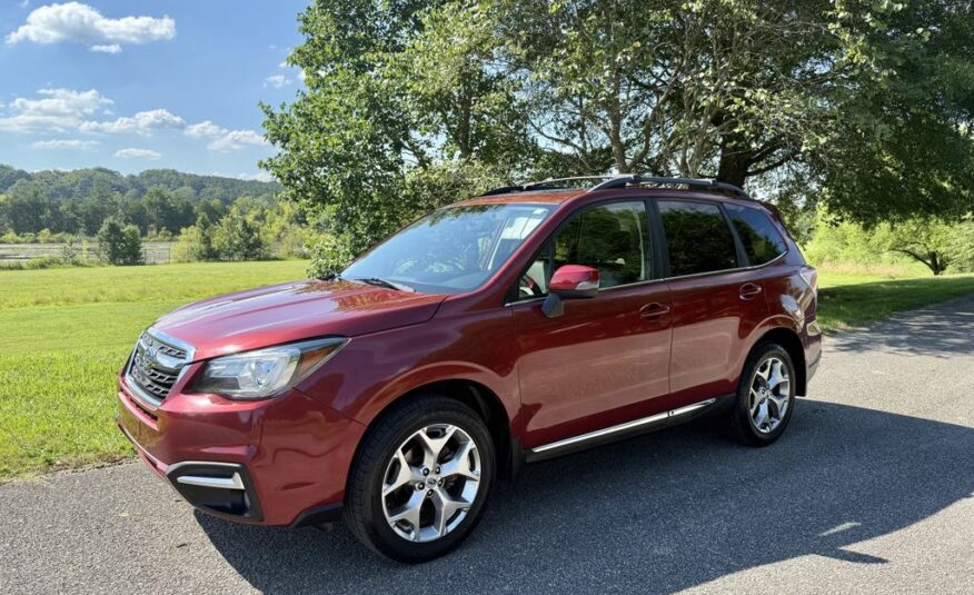 2017 Subaru Forester 2.5i Touring   <a href='http://www.carfax.com/VehicleHistory/p/Report.cfx?partner=DVW_1&vin=JF2SJAWC2HH555902'><img src='http://www.carfaxonline.com/assets/subscriber/carfax_free_button.gif' width='120' height='49' border='0'></a>